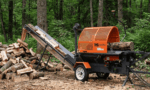 Following a log through a firewood processor as it saws, splits, and stacks a Canadian summer woodpile